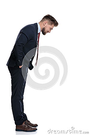 Side view of a focused businessman looking down Stock Photo