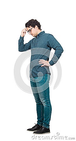 Side view full length portrait, pensive businessman keeps hand to forehead, isolated on white background with copy space. Tired Stock Photo