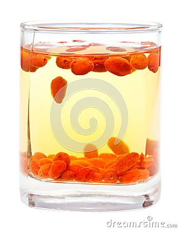 Side view glass with goji berries infusion isolated Stock Photo
