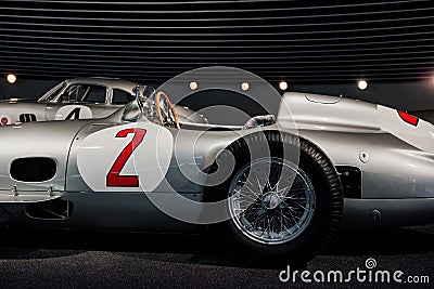 Side view of grey retro sport coupe cabriolet, orange number 2 painted on left door, with wooden steering wheel, mirror Editorial Stock Photo