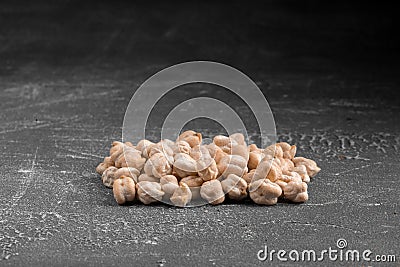 Handful of raw uncooked chickpeas on the grey background Stock Photo