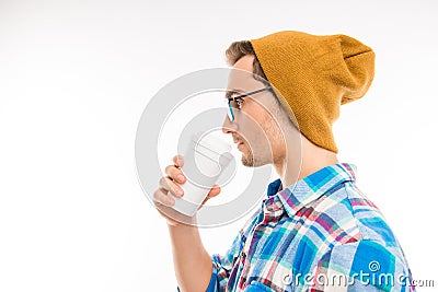 Side view of a handsome man with glasses cocktail and hat Stock Photo