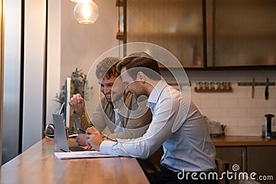 Side view happy colleagues working on online project together Stock Photo