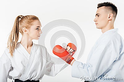 side view of karate fighters touching with gloves Stock Photo