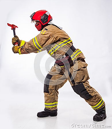 Fire fighter with ax on white Stock Photo