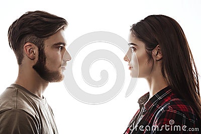 Side view. Man and woman facing each other, eyes open. Stock Photo