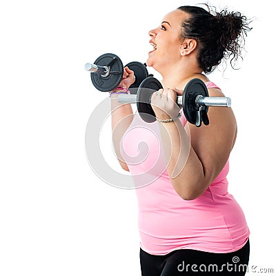 Side view of obese girl doing workout. Stock Photo