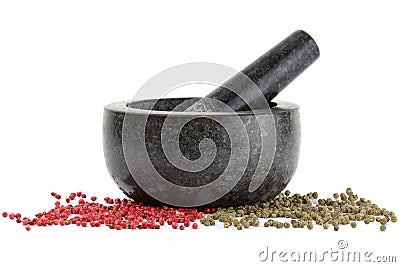 Side view of peppercorns with mortar and pestle isolated on white Stock Photo