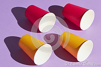 Side view photo, four red and yellow cups Stock Photo