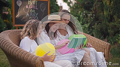 Side view portrait of carefree laughing pregnant woman surfing social media on tablet having fun with girls at baby stock video Side view portrait of carefree laughing pregnant woman surfing social media on tablet having fun with girls at baby stock video