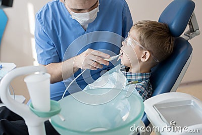 Dentist Treating Little Kid Stock Photo