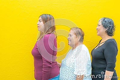 Side view profiles of granddaughter grandmother and daughter Stock Photo