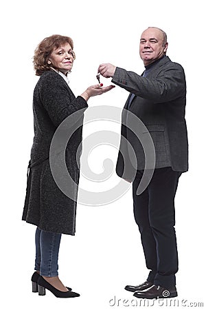 side view. realtor handing keys to a happy woman. Stock Photo