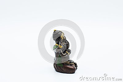 An ornate statue of ganesh / ganesha statue on an isolated white background Stock Photo