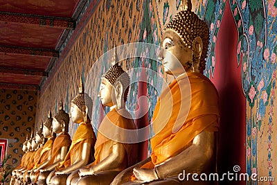 Side view of religious statues icon in temple of dawn Stock Photo