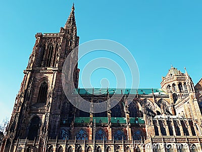 Side view of Roman Catholic Cathedral Notre Dame de Strasbourg in Alsace, France. Majestic gothic architecture Stock Photo