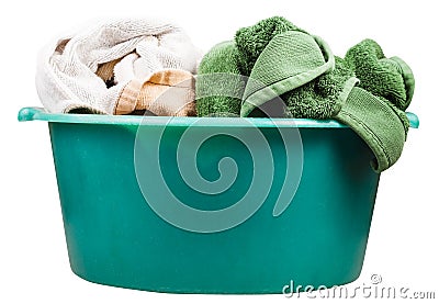 Side view of round green wash basin with towels Stock Photo