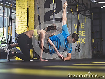 Calm athletes making physical exercise Stock Photo