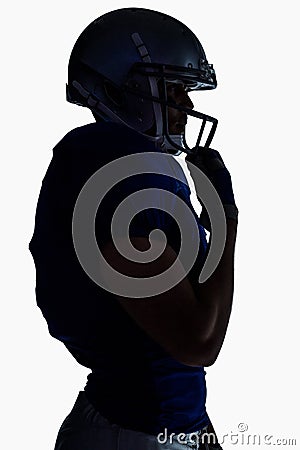 Side view of silhouette American football player wearing helmet Stock Photo