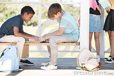 Multiethnic boys studying together Stock Photo