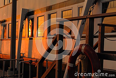 Side View of a Steamship Bathed in Sunset Glow Stock Photo