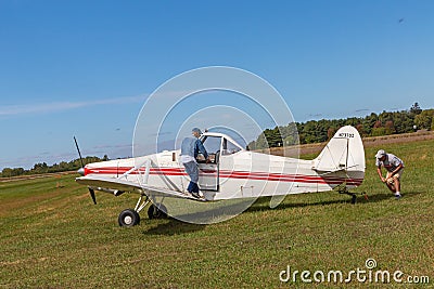 The side view of the tail, body, wings, nose and propeller of Piper PA-25 Pawnee tow aircraft Editorial Stock Photo
