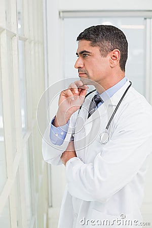 Side view of a thoughtful male doctor in hospital Stock Photo