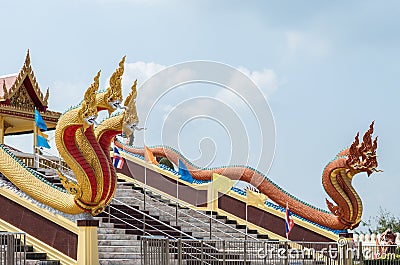 Side view of the three head golden and bronze great naga sculpture Stock Photo