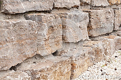 Side view to old wall of limestone blocks Stock Photo