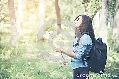 Side view of traveler woman searching right direction on map Stock Photo