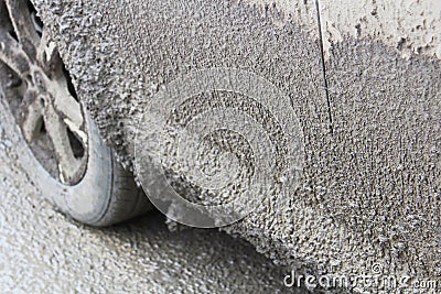 Side view of a vehicle covered in thick mud Stock Photo