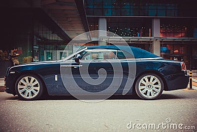 Side view of a very expensive premium Rolls-Royce Dawn car, luxury dark blue convertible Editorial Stock Photo