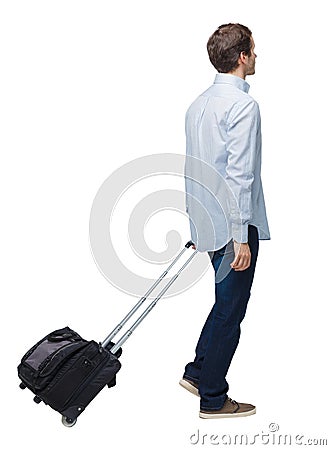 Side view of walking business man with suitcase talking on the phone Stock Photo