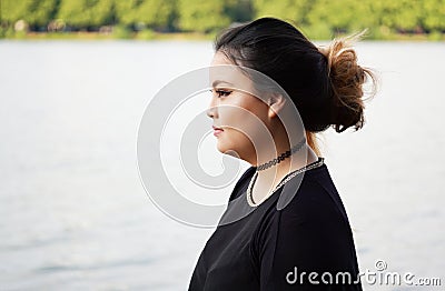 Side view of young asian woman Stock Photo