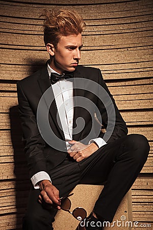 Side view of a young business man looking down Stock Photo