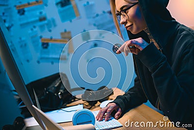 side view of young female hacker Editorial Stock Photo