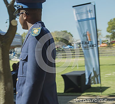 Side view of a young south african policeman wearing glasses Editorial Stock Photo