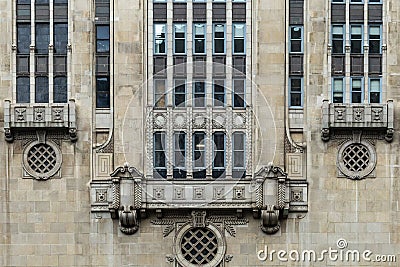Side of vintage art deco block building with relief sculptures in urban Chicago Stock Photo