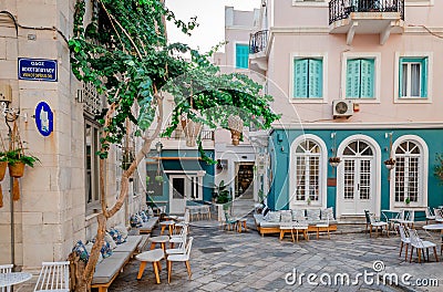 Sidewalk cafes in the alleys of Ermoupolis, the capital of Syros Editorial Stock Photo