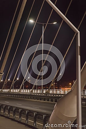 Sidewalk and highway going through bridge Editorial Stock Photo