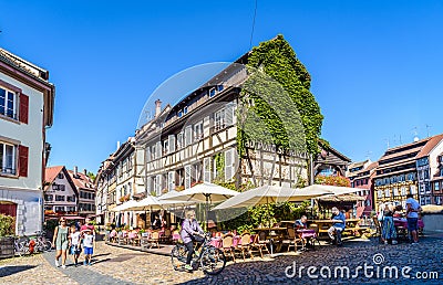 A sidewalk restaurant in a half-timbered building in the Petite France quarter in Strasbourg, France Editorial Stock Photo
