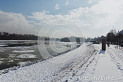 Sidewalk and river dam covered with slush and snow in Szentendre, Hungary Stock Photo