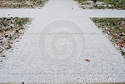 Sidewalk with an untouched dusting of snow Stock Photo