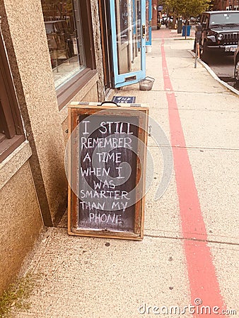 Quirky sign social media sandwich board - smarter than my phone Editorial Stock Photo