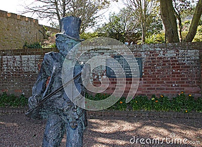 SIDMOUTH, DEVON - APRIL 1ST 2012: The statue of the Sidmouth Fiddler stands in Connaught gardens and commemorates 50 years of the Editorial Stock Photo