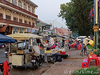 A colorful street market in Cambodia, vendors near shopping carts Editorial Stock Photo