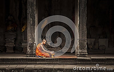 Buddhist monk in Angkor Wat temple Editorial Stock Photo