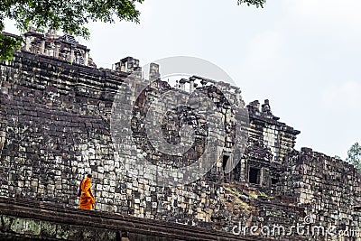 Siem Reap, Cambodia - 25 March 2018: Buddhist monks in orange clothes in Angkor Wat temples. Editorial Stock Photo