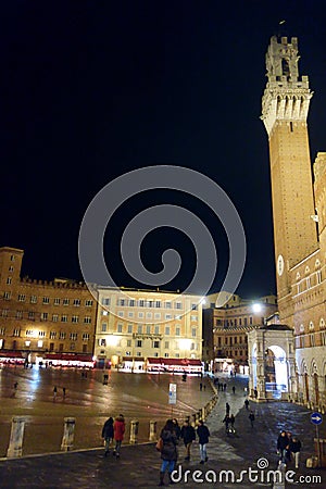 Siena by night. Piazza del Campo and Tower del Mangia illuminated. Stock Photo