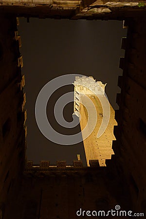 Siena by night. Piazza del Campo and Tower del Mangia illuminated. Stock Photo
